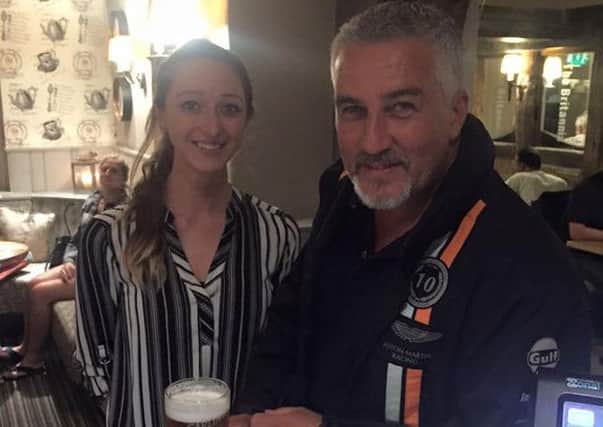 Paul Hollywood poses for a pic at the Britannia pub near Brackmills, with staff member Amy Williams. DbulNWuPEeHBy7PT1vuA
