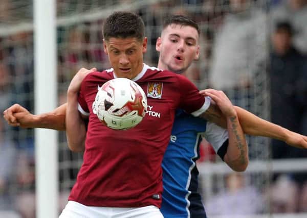 TOTALLY COMMITTED - Cobblers striker Alex Revell