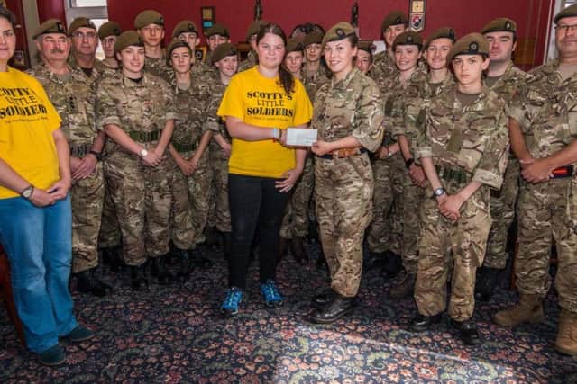 Scotty's Little Soldiers receive the cheque from the cadets