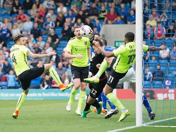 SO CLOSE - Chesterfield's defence clear the danger in the clash against the Cobblers