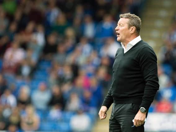 Danny Wilson watches his Chesterfield team see off the Cobblers