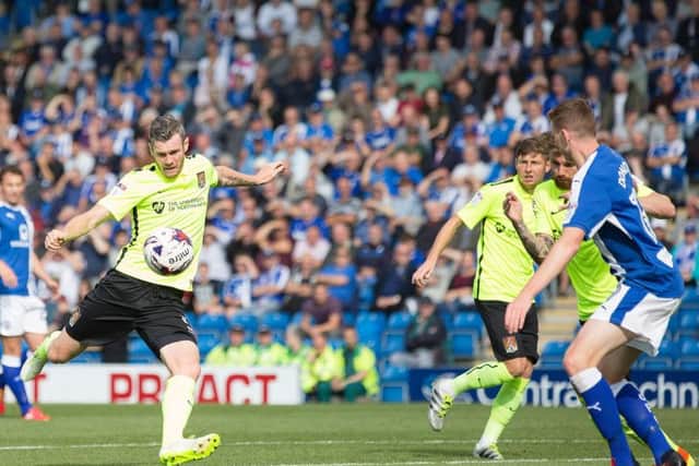 Zander Diamond lines up a shot on goal at Chesterfield