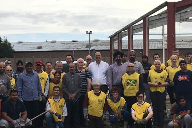 Some of the volunteers who helped to clear a site in Northampton for a Gurdwara
