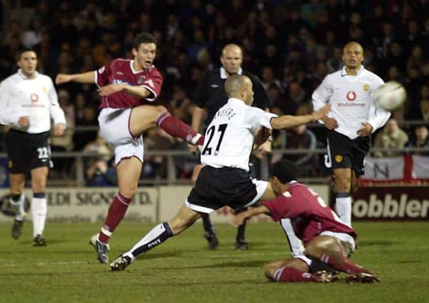 SO CLOSE - Marc Richards lets fly with the 18-yard volley that smacked against the crossbar when Manchester United last played at Sixfields in 2004 (Picture: Pete Norton)