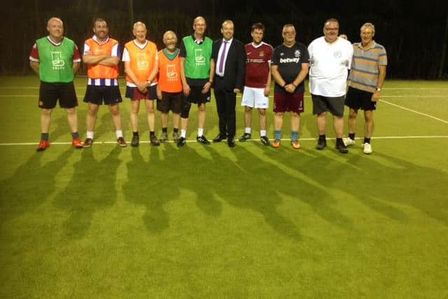 Daventry MP Chris Heaton-Harris met participants of a walking football scheme in Earls Barton.