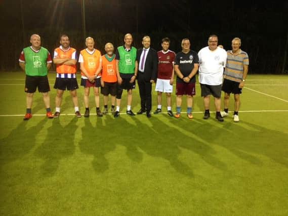 Daventry MP Chris Heaton-Harris met participants of a walking football scheme in Earls Barton.