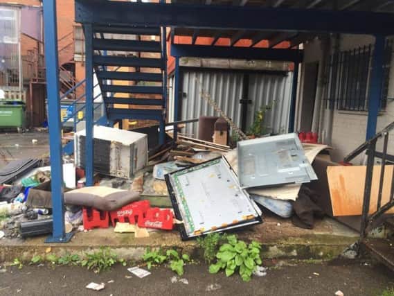 Fly-tipping on a car park at Abington Place has prompted a local lawyer to start clearing it up himself.