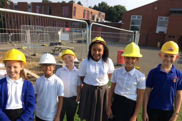 Moulton Primary School pupils with the new extension to the school now rated Good by Ofsted