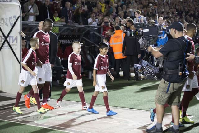 Gabriel Zakuani steps out of the tunnel at Sixfields. Pictures: Kirsty Edmonds