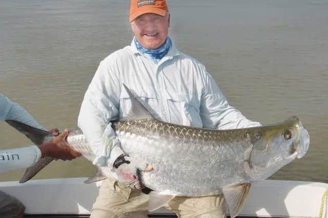 Mike Green with 100lb giant tarpon caught on fly. Bigger ones were too 'frisky' to bring aboard!