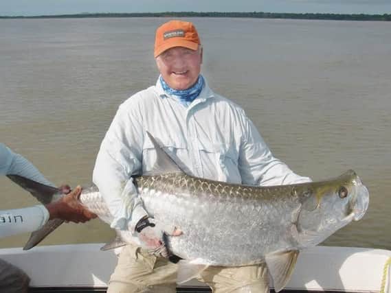 Mike Green with 100lb giant tarpon caught on fly. Bigger ones were too 'frisky' to bring aboard!