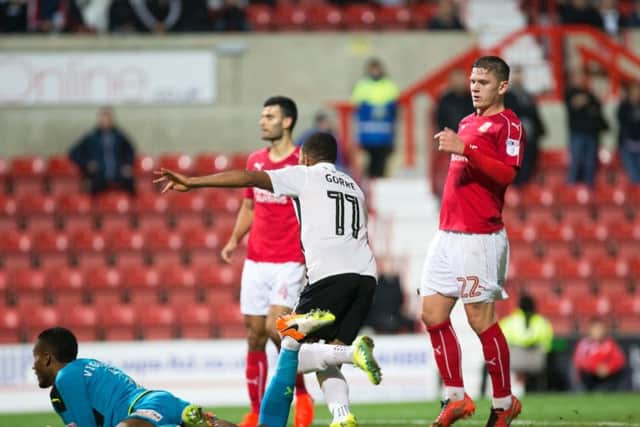 GET IN THERE! - Kenji Gorre runs away to celebrate after scoring at Swindon (Pictures: Kirsty Edmonds)