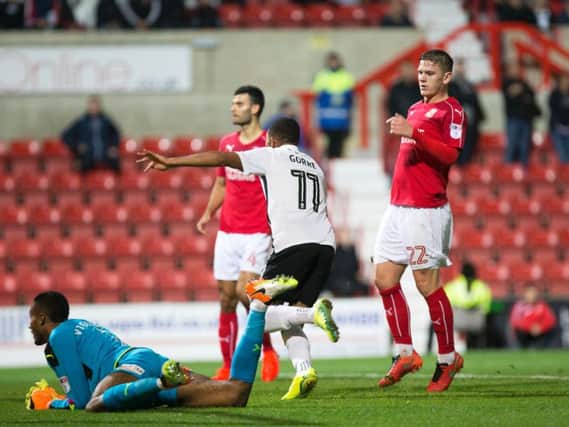 GET IN THERE! - Kenji Gorre runs away to celebrate after scoring at Swindon (Pictures: Kirsty Edmonds)