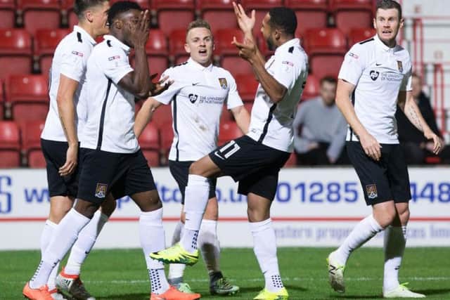 Kenji Gorre and his Cobblers team-mates celebrate