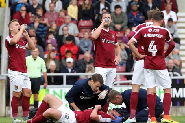 Jak McCourt receives treatment after he suffered a head injury in Saturday's win over Southend United (Picture: Sharon Lucey)