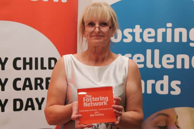 Northamptonshire County Council social worker Mel Godfrey with her Fostering Excellence Award