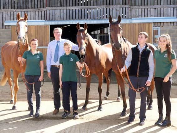 Trainer Ben Case is pictured with (from left) First Drift, stable girl Kodie Aubrey, George Case, Croco Bay, Pulp Fiction, jockey Kielan Woods and Millie Lucock at his  Wardington Gate Farm stables on Sunday (Picture courtesy of Tudor Photography)