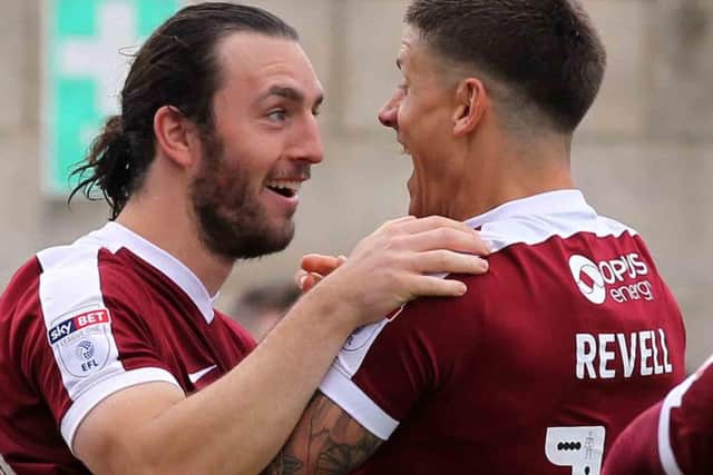 ALL SMILES - John-Joe O'Toole celebrates with Alex Revell following his goal in Saturday's 4-0 win over Southend United (Picture: Sharon Lucey)
