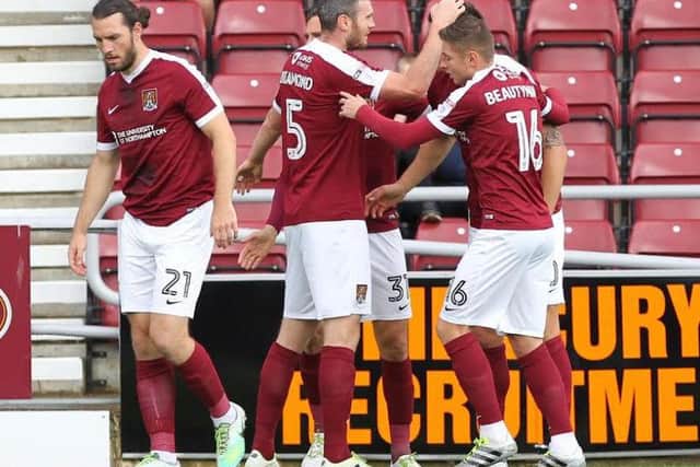 GREAT START - the Cobblers players celebrate Alex Revell's opening goal against Bristol Rovers (Pictures: Sharon Lucey)