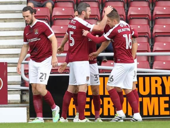 GREAT START - the Cobblers players celebrate Alex Revell's opening goal against Bristol Rovers (Pictures: Sharon Lucey)