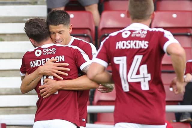 EARLY BOOST - Alex Revell celebrates with Paul Anderson after his early goal at Sixfields