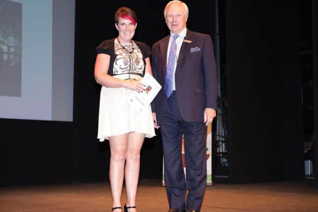 David Laing presents the Northampton Capture the Moment Award to Ria Farmer