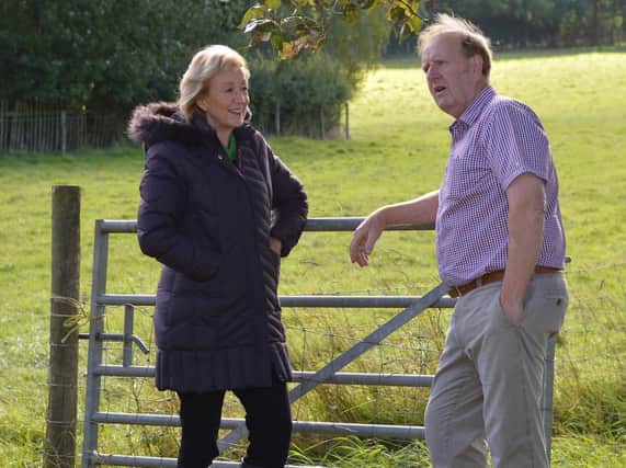 The Secretary of State for Environment, Food and Rural Affairs, Andrea Leadsom, with farmer David Banner during a visit to South Northamptonshire