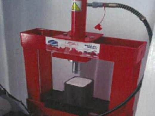 A presser recovered from one of the safe houses was used to compact high purity cocaine into blocks.