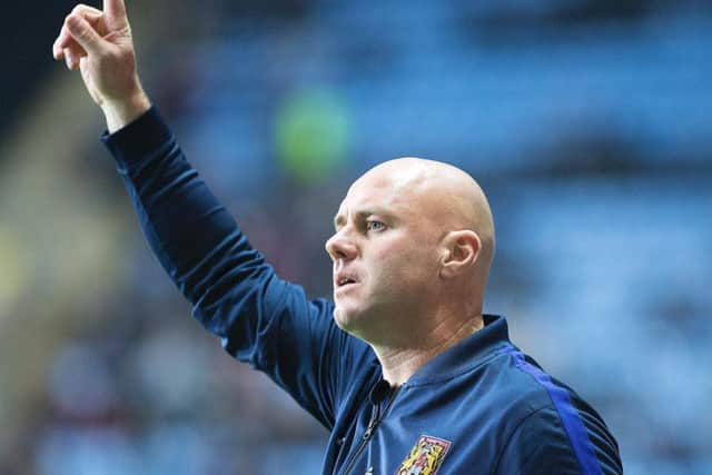 Cobblers manager Rob Page watches his side lose at Coventry City in the Checkatrade Trophy (Pictures: Kirsty Edmonds)