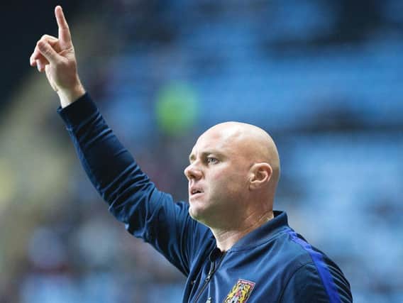 Cobblers manager Rob Page watches his side lose at Coventry City in the Checkatrade Trophy (Pictures: Kirsty Edmonds)