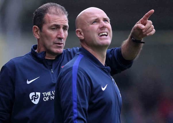 Cobblers boss Rob Page (right) and assistant Paul Wilkinson