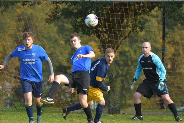 Harry Cadden makes a clearance during Becket FC's 7-0 defeat to Gallery in division one (Picture: Dave Ikin)
