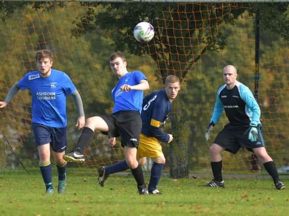 Harry Cadden makes a clearance during Becket FC's 7-0 defeat to Gallery in division one (Picture: Dave Ikin)