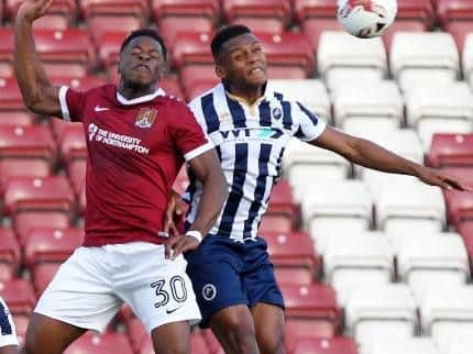 JJ Hooper challenges for the ball during Northampton's clash with Millwall. Picture by Sharon Lucey