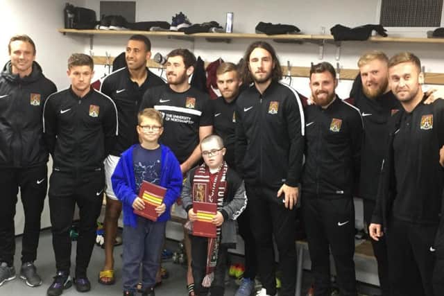 Max meets the Cobblers team ahead of the Millwall game.
