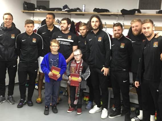 Max meets the Cobblers team ahead of the Millwall game.