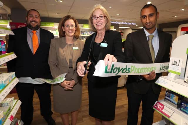 Richard Knott, area manager, Barbara Wills, pharmacy manager, Marjorie Tomalin, relief manager and Vishaal Pandya, pharmacist, cut the ribbon of the new Lloyds Pharmacy