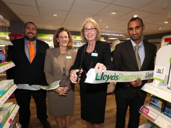 Richard Knott, area manager, Barbara Wills, pharmacy manager, Marjorie Tomalin, relief manager and Vishaal Pandya, pharmacist, cut the ribbon of the new Lloyds Pharmacy