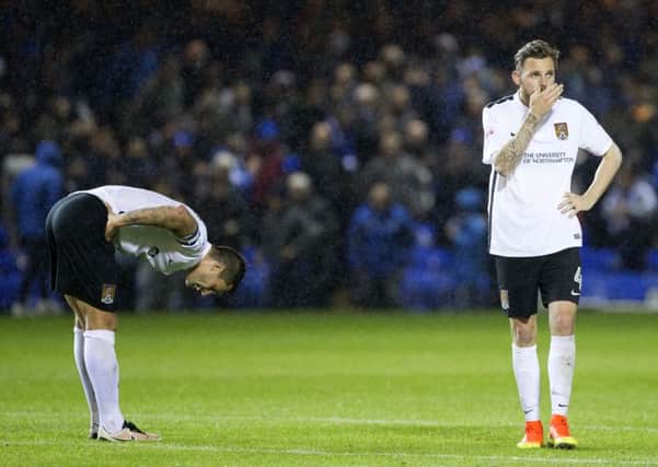 BAD NIGHT - Marc Richards and Paul Anderson show their dismay at the derby defeat at Peterborough United (PIctures: Kirsty Edmonds)