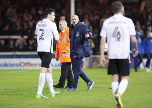 Tuesday night's defeat at Peterborough United was a tough one for Cobblers boss Rob Page, his players and the club's supporters to take (Pictures: Kirsty Edmonds)