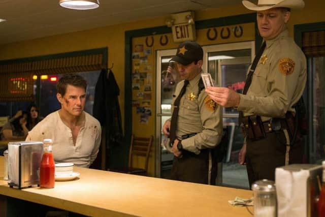 A battered Tom Cruise as Jack Reacher
