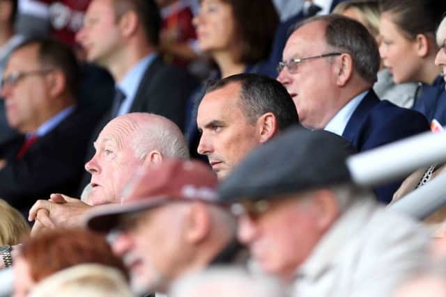 Kelvin Thomas says legal issues are still causing delays to the East Stand development.