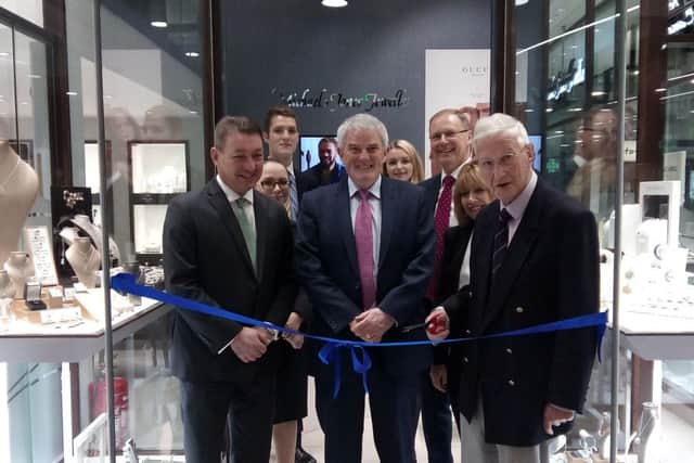 Michael Jones cutting the ribon at shop unveiling in Northampton Grosvener centre