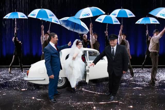 Singing in the rain! Zoe Whitestone and her husband Marc were given TSB umbrellas when the rain started pouring at their wedding