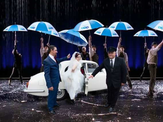 Singing in the rain! Zoe Whitestone and her husband Marc were given TSB umbrellas when the rain started pouring at their wedding
