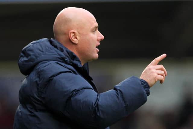 Cobblers boss Rob Page watches his team beat Bury