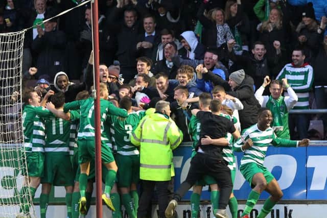 TOO CLOSE FOR COMFORT - the Northwich Victoria players celebrate the first of their two goals at the Cobblers last season. The non-Leaguers led 2-0 until a quickfire late treble of goals saw Northampton win 3-2