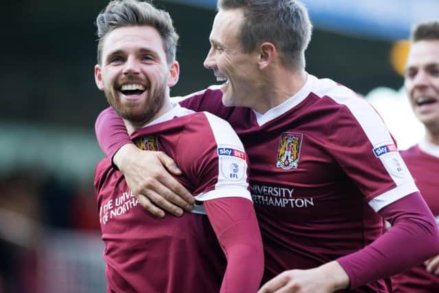 OFF TO A FLYER: Paul Anderson is congratulated after his screamer gave Cobblers the perfect start. Pictures: Kirsty Edmonds