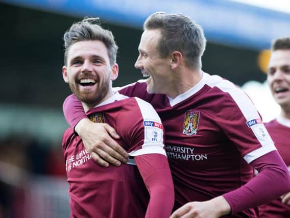 OFF TO A FLYER: Paul Anderson is congratulated after his screamer gave Cobblers the perfect start. Pictures: Kirsty Edmonds