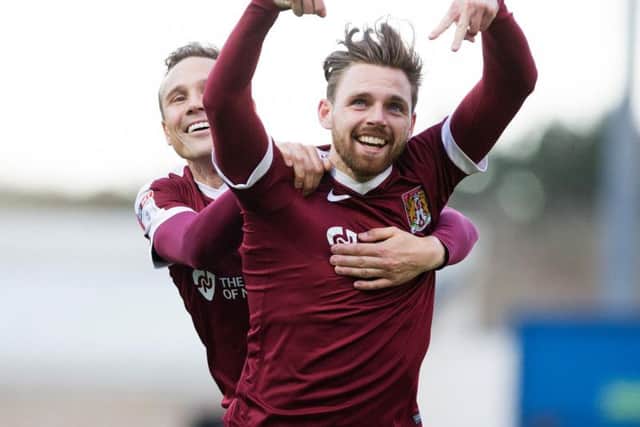 Paul Anderson celebrates